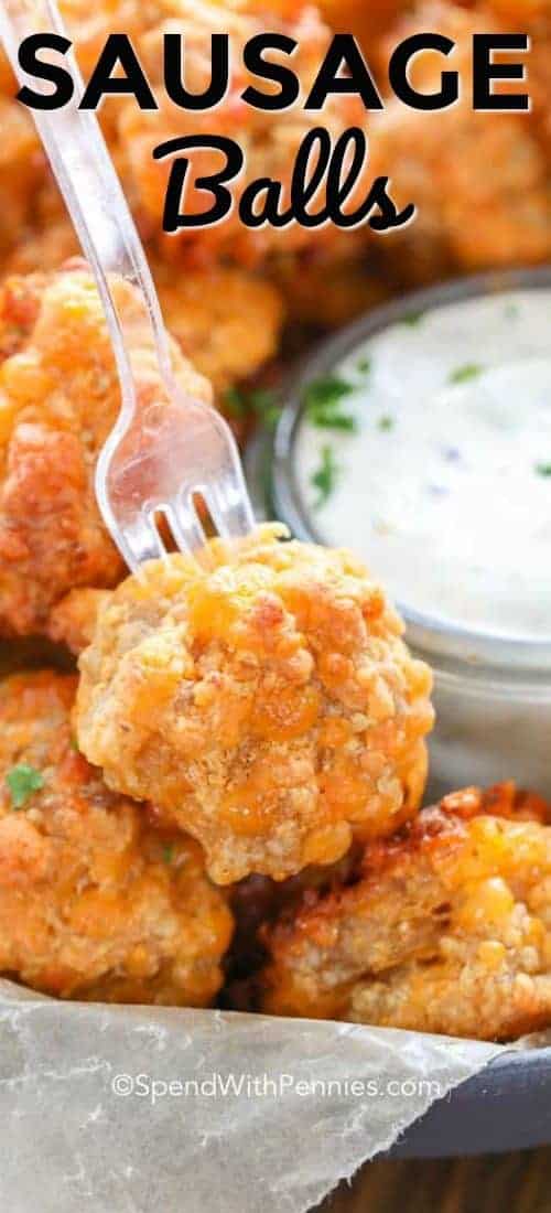 Sausage Ball on a cocktail fork with a title