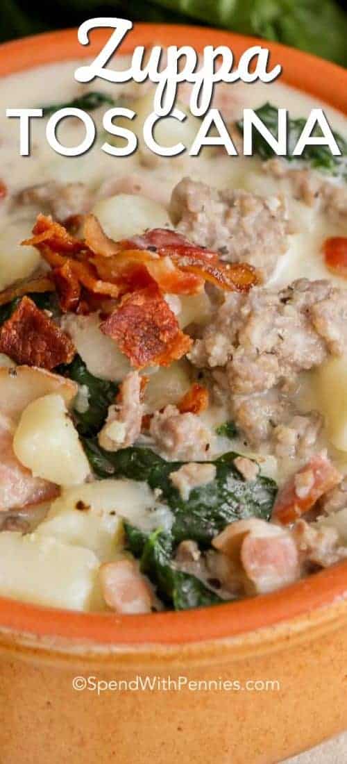 Zuppa Toscana is quick and easy to make at home and delicious! Loaded with sausage, potatoes and bacon, this is definitely a crowd pleaser! #spendwithpennies #zuppatoscana #easyrecipe #easysoup #creamysoup #withbacon #withspinach Zuppa Toscana served in a bowl and garnished with bacon bits