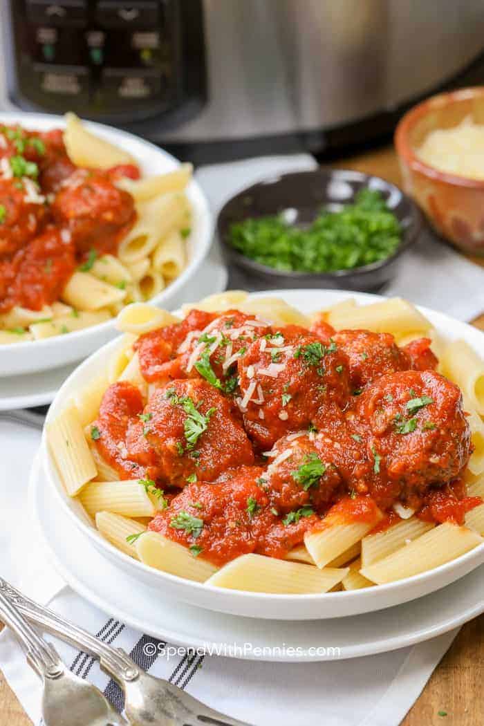 If you want homemade crockpot meatballs with minimal effort, this recipe is the plan. The meatballs are seasoned simply and shaped quickly, then the slow cooker does the rest in a garlicky marinara tomato sauce. This is an easy weeknight dinner for busy days and a smart option for feeding a crowd. Serve over pasta and freeze extra portions for later. #spendwithpennies Crockpot Meatballs served over rigatoni on a white plate