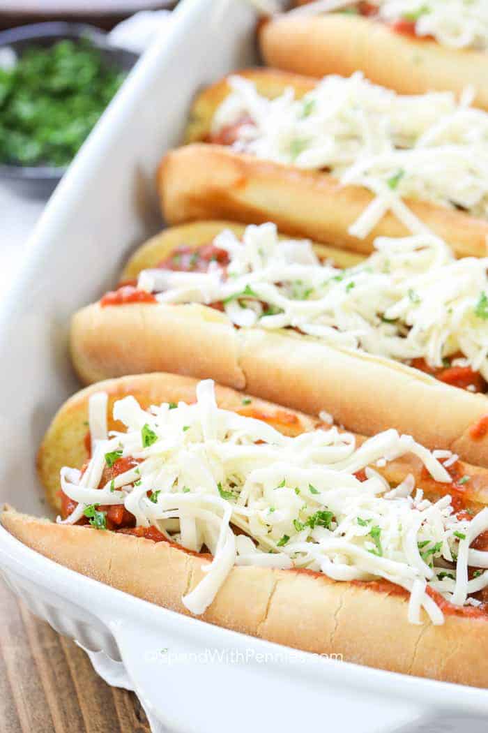 Meatball Sub in white baking dish with cheese on top