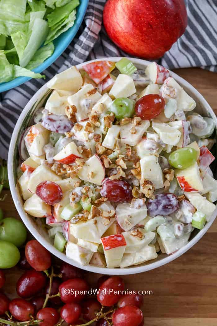 Waldorf salad is a mix of delicious flavors and textures. It includes crunchy apples, juicy grapes, crispy celery, and nutty walnuts, all held together with a creamy dressing. This tasty salad is great for a light meal or as a side dish with lunch! #waldorfsalad #recipe #sidedish #spendwithpennies Overhead Waldorf Salad