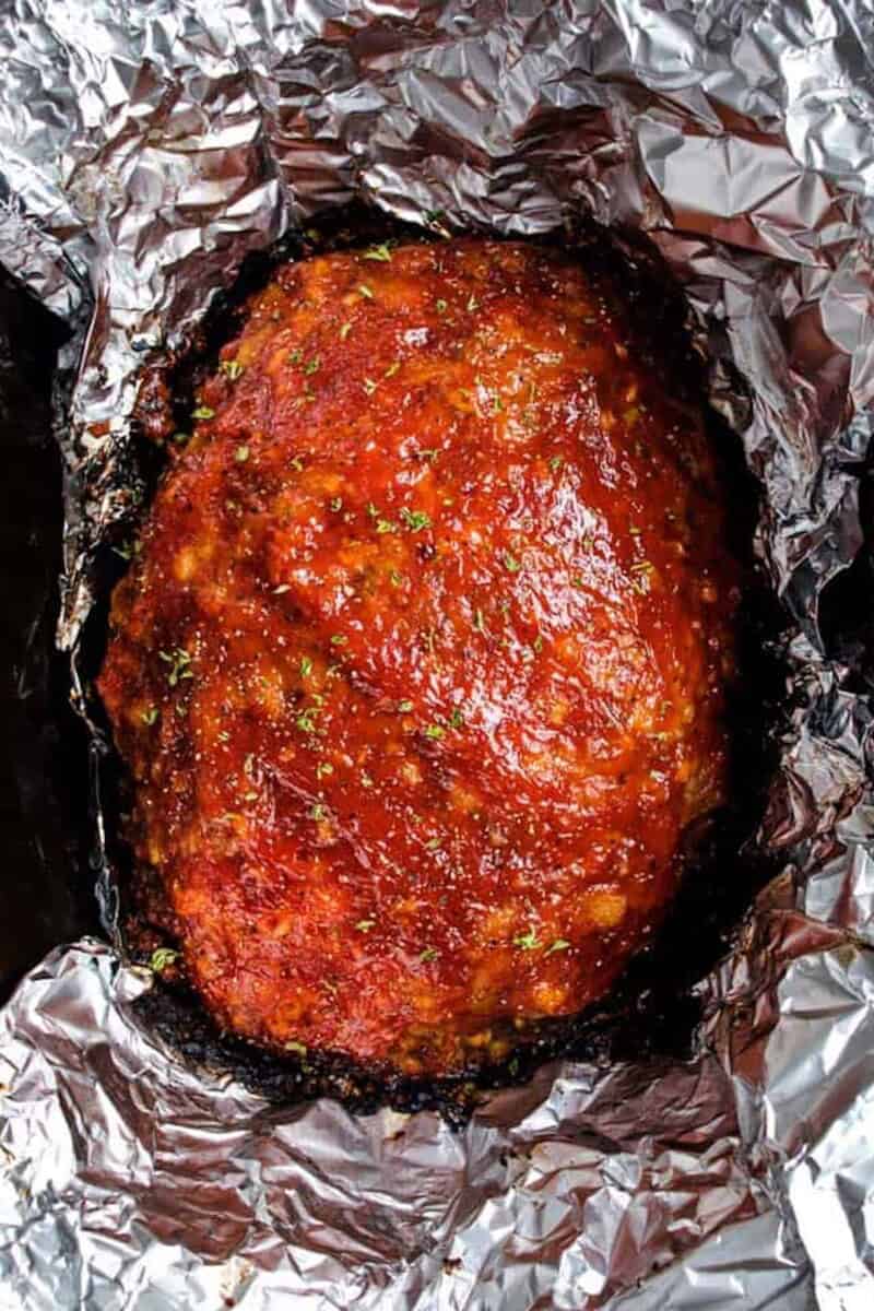 This Crockpot Meatloaf is a great way to enjoy classic comfort food, with less stress, and without tying up your oven! #spendwithpennies #meatloaf #beefrecipe #stuffing #easyrecipe #comfortfood #crockpot #crockpotmeatloaf #slowcooker #easydinner #stuffingmix crockpot meatloaf