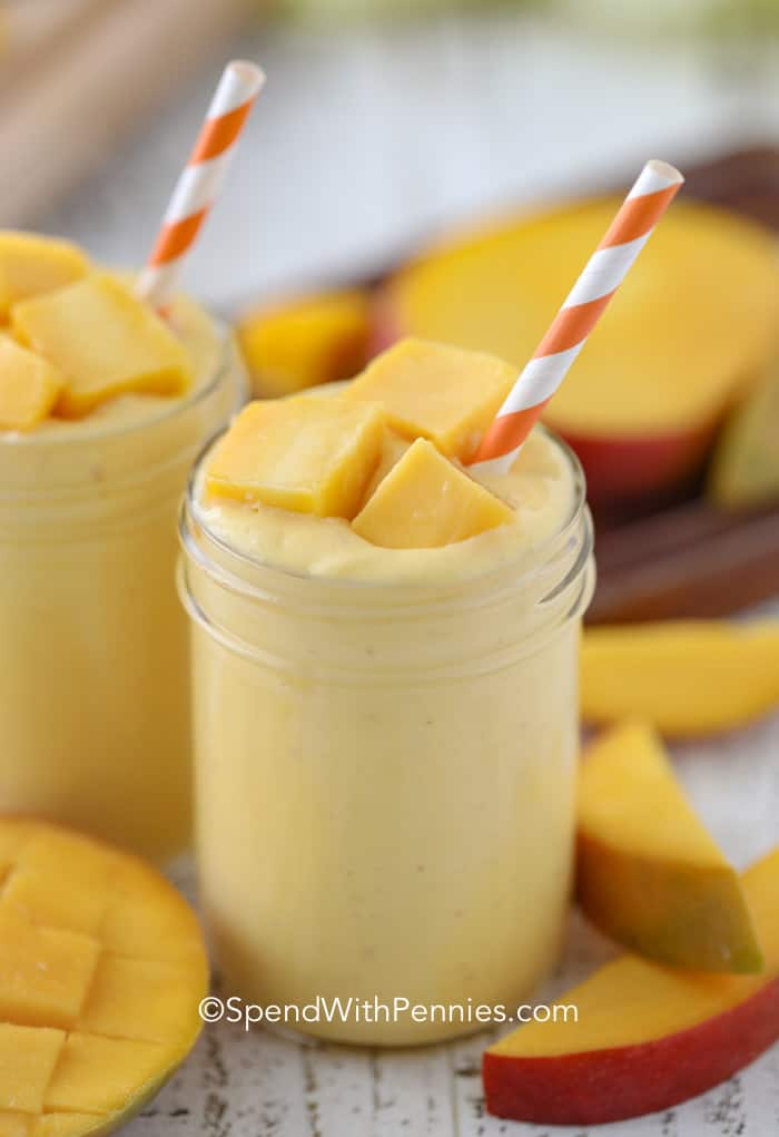 Mango Smoothie in glass with a straw