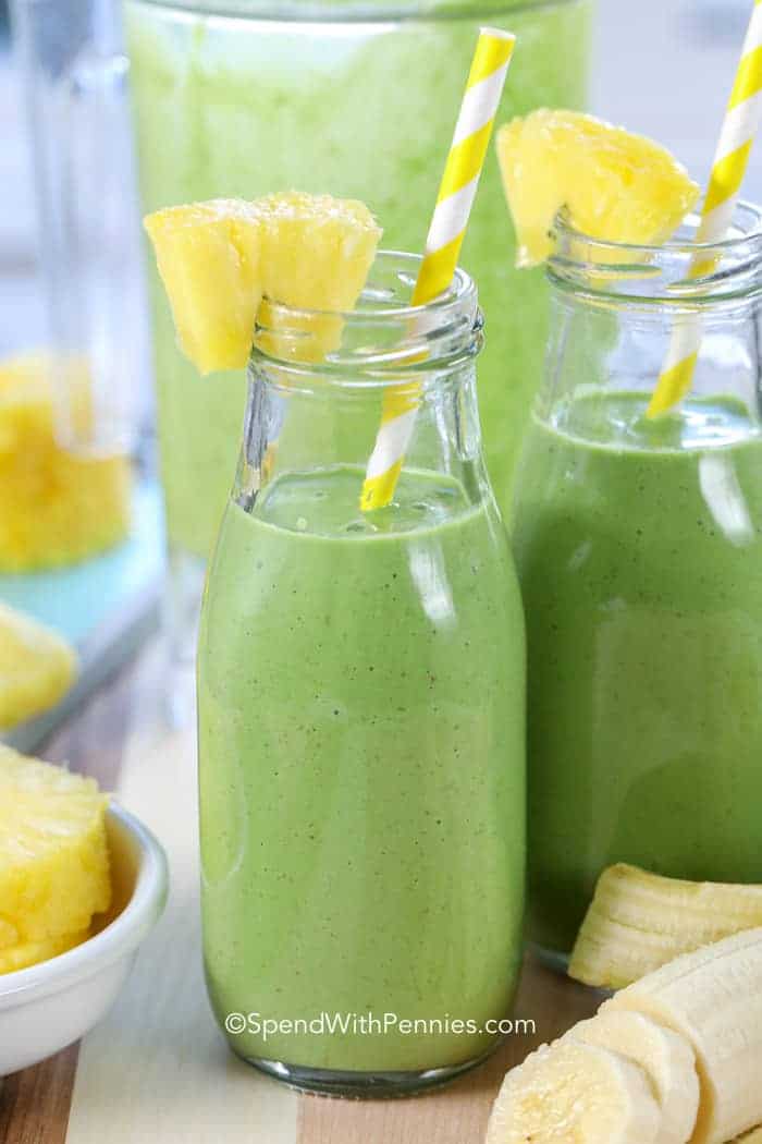 Green Smoothies in jars with straws and pineapple