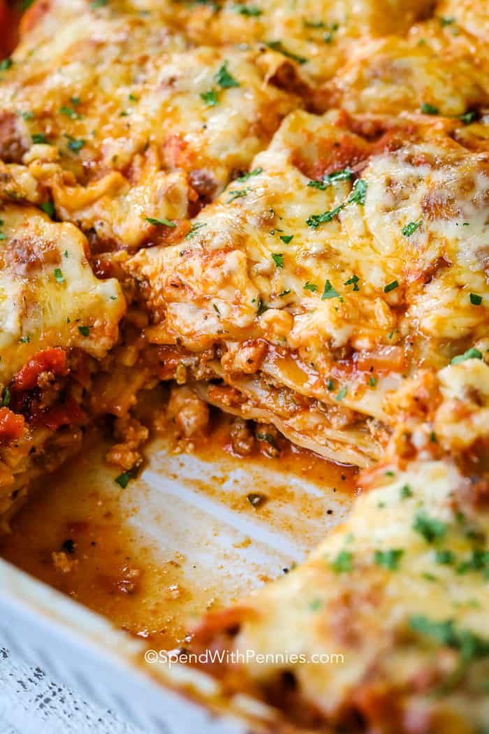 This easy homemade lasagna is one of my favorite comfort foods. Layers of pasta with cheese and a zesty meat sauce! #spendwithpennies #lasagna #homemadelasagna #italianlasagna #easylasagna #classiclasagna Easy Homemade Lasagna in a serving dish