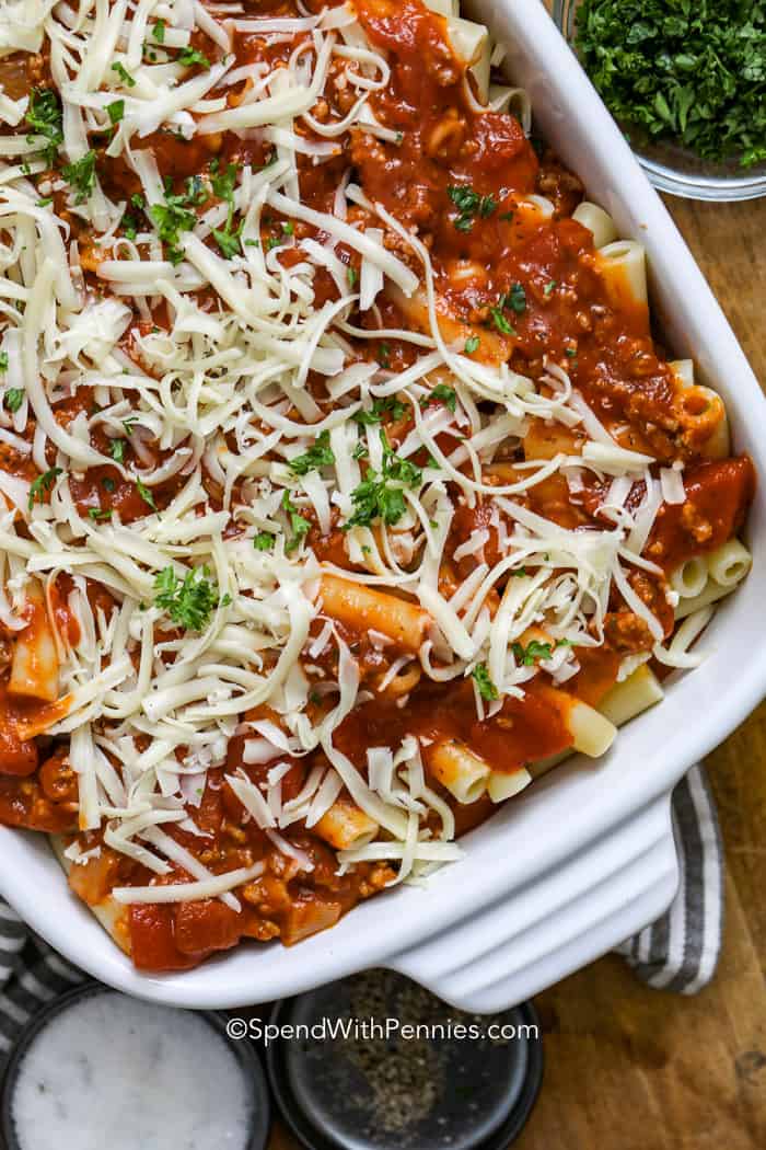 Baked ziti in a casserole dish before being cooked in the oven