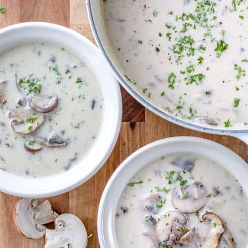 Overhead shot of two bowls of Cream of Mushroom Soup