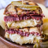 stacked reuben sandwich on a plate