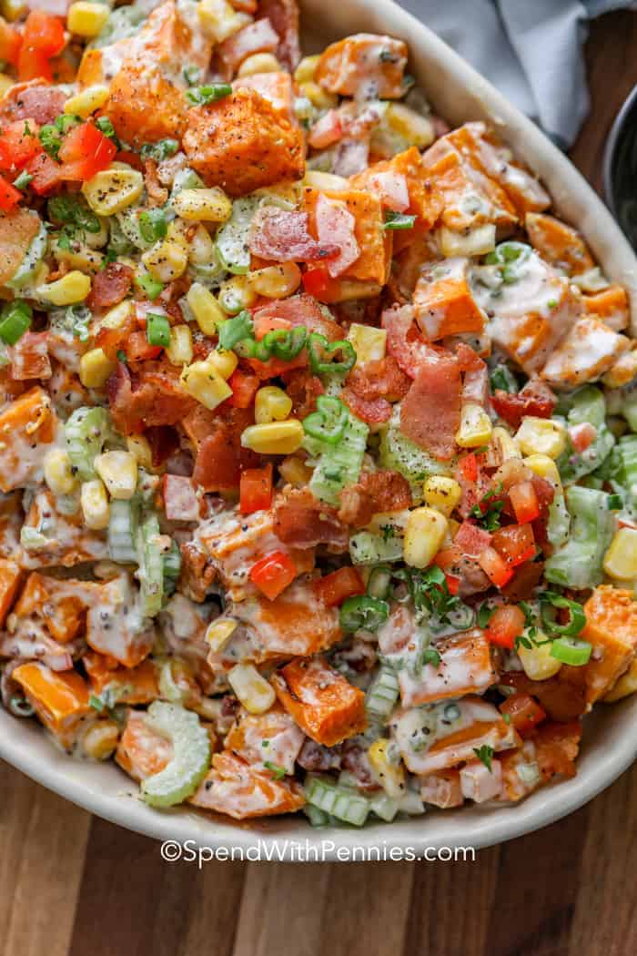 Sweet Potato Salad topped with corn and green onions