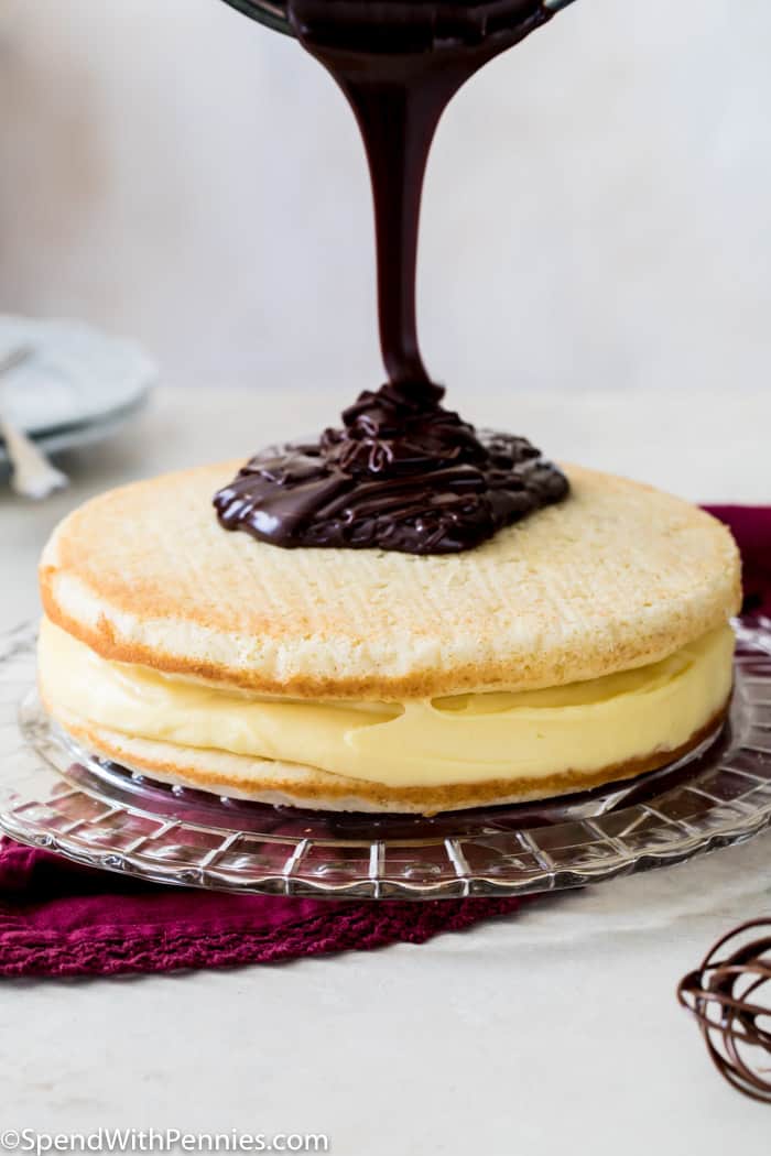 Pouring chocolate over a cream pie