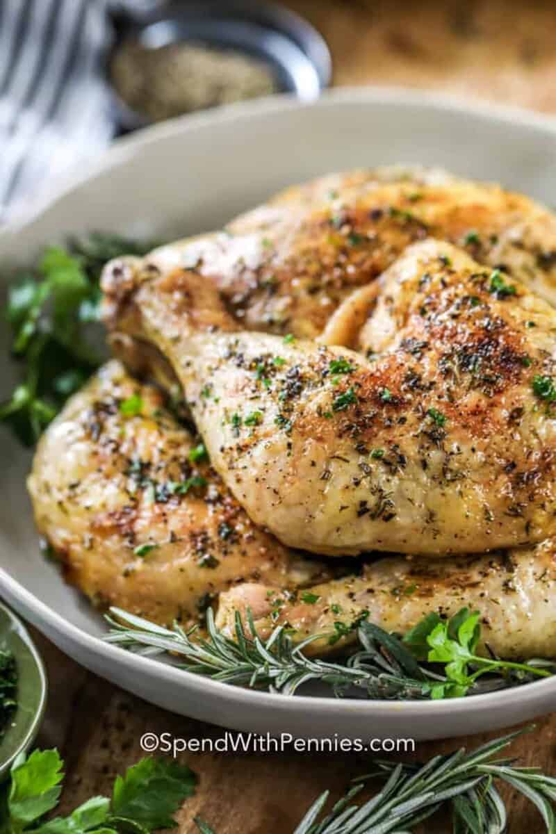 a plate of baked chicken legs