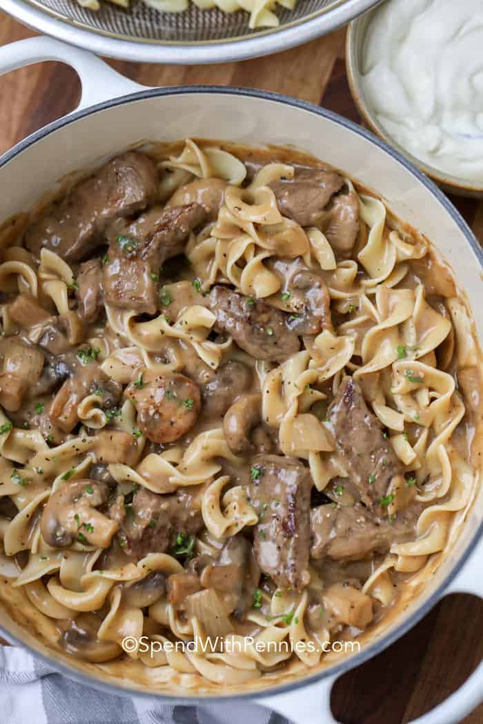 Beef stroganoff with egg noodles in a pot ready to serve 