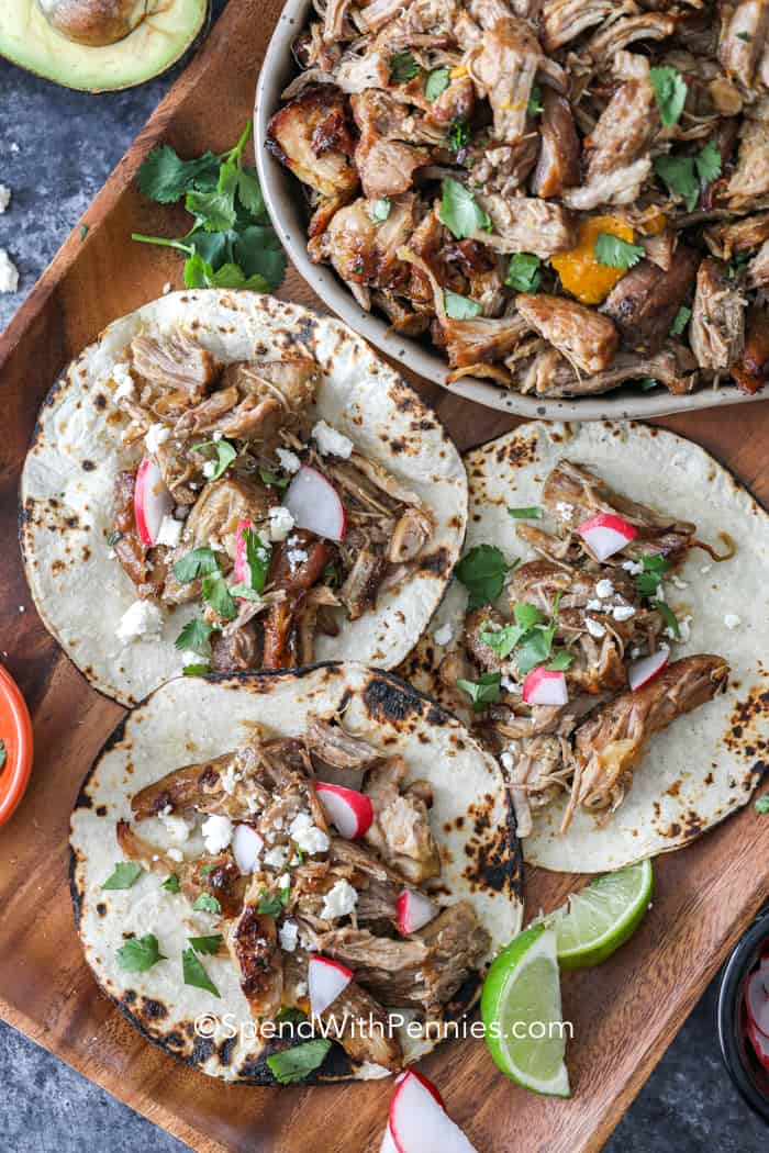 Overhead shot of Pork Carnitas tacos on a cutting board