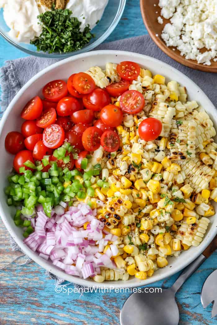 Mexican corn salad ingredients in a bowl