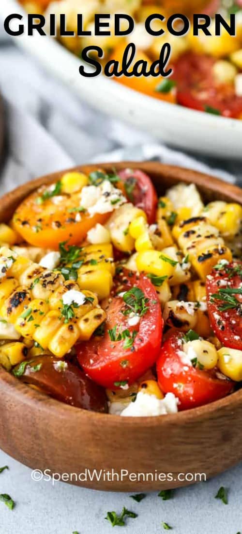 Grilled corn salad is an easy salad to prepare ahead of time. Once your corn is grilled you toss it with tomatoes, crumbled feta and fresh basil to create this tasty salad. Top with a simple oil vinaigrette and let chill before serving! Mmmm! #spendwithpennies #cornsalad #sidedish #salad #barbecue #grilledcorn #makeahead