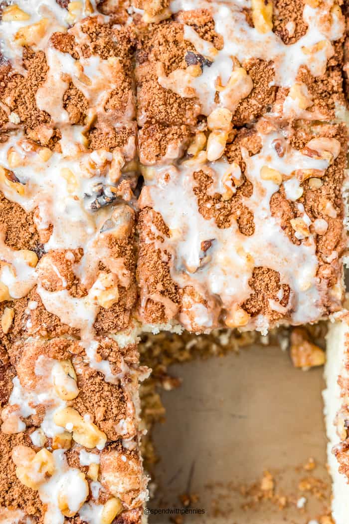 Overhead photo of coffee cake slices in a pan with one slice removed.