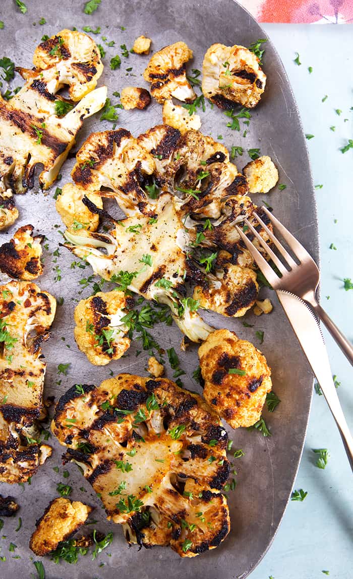 Grilled Cauliflower Steaks with a fork