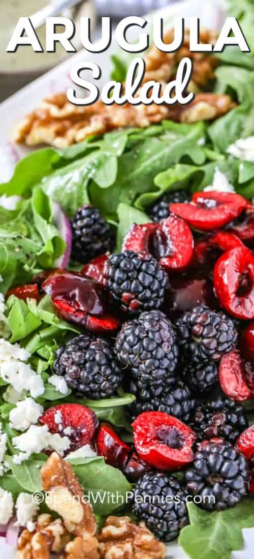 This simple arugula salad is made with baby arugula, strawberries, toasted pecans, and feta, all tossed in a simple vinaigrette dressing. Have this easy summer salad on the table in 10 minutes, with it's light and refreshing flavors it is sure to become a family flavor! #spendwithpennies #arugulasalad #summersalad #sidedish #10minutesalad