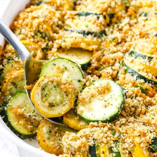 a spoon serving squash casserole