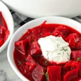 a serving of Hot Borscht in a bowl with sour cream