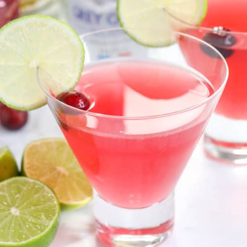 Cosmopolitans in glasses garnished with lime