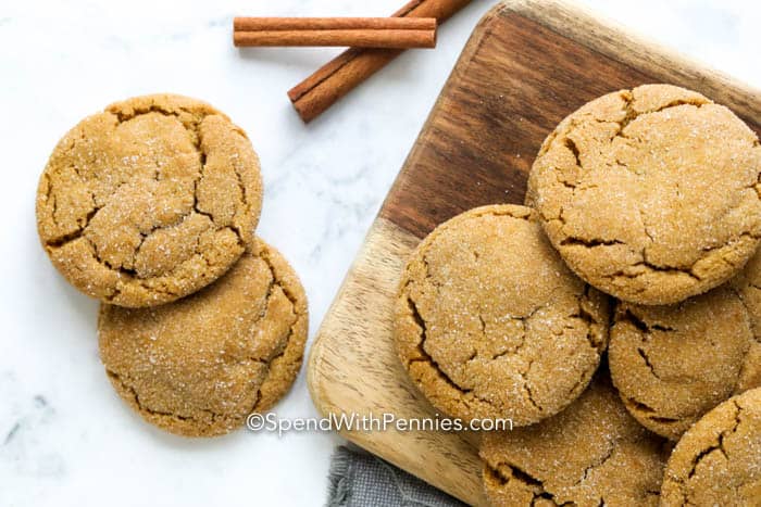 Ginger snaps on a wooden board and marble board with cinnamon sticks