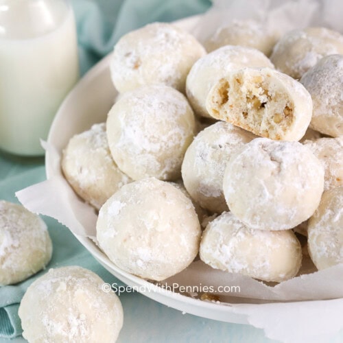 Snowball cookies in a bowl with milk