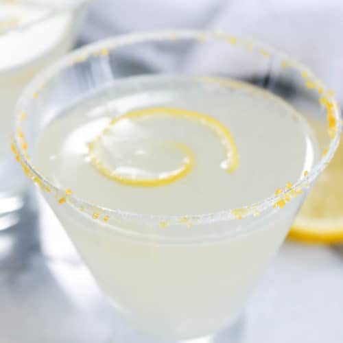 Lemon drop in a glass with lemon peel as garnish