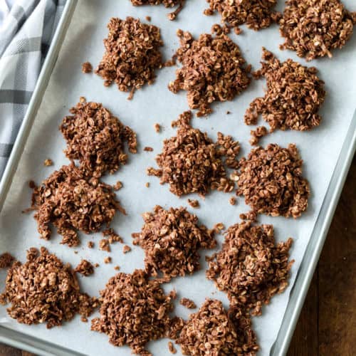 No bake oatmeal cookies on parchment paper on a cookie sheet