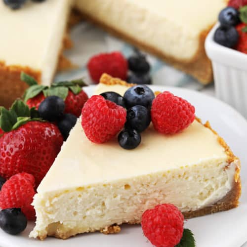 Slice of cheesecake on a plate with berries