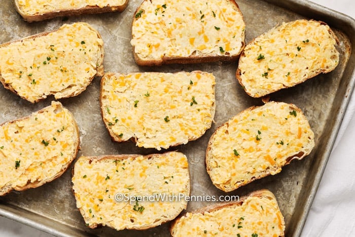 Raw Garlic Cheese Toast on a baking sheet