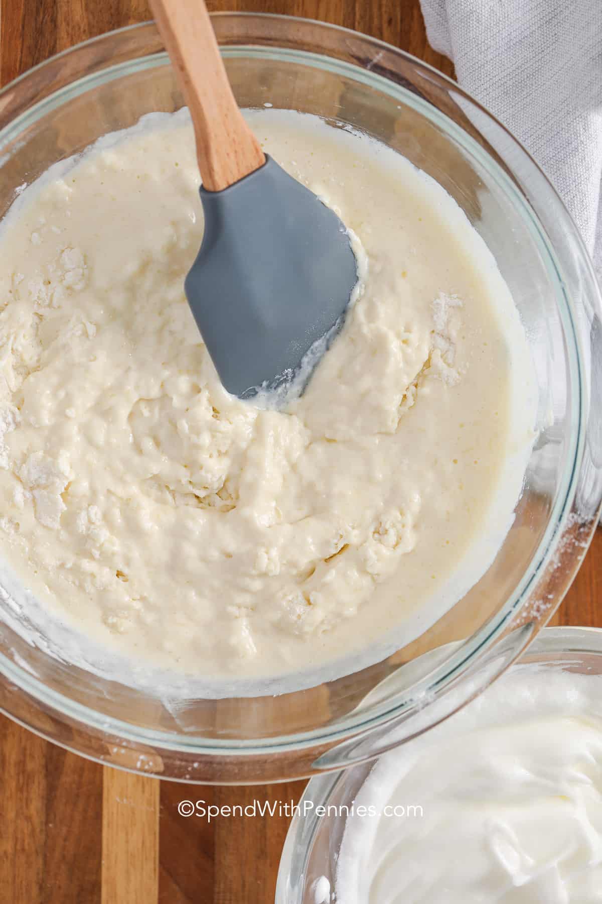 mixing waffle batter in a bowl