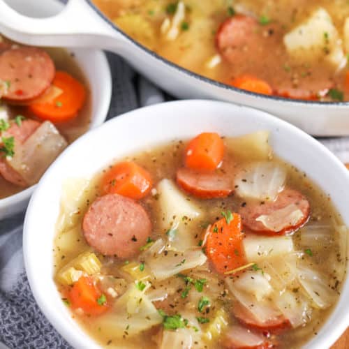 White bowl filled with Sausage and Cabbage Soup