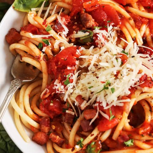 Bucatini Amatriciana with shredded parmesan cheese