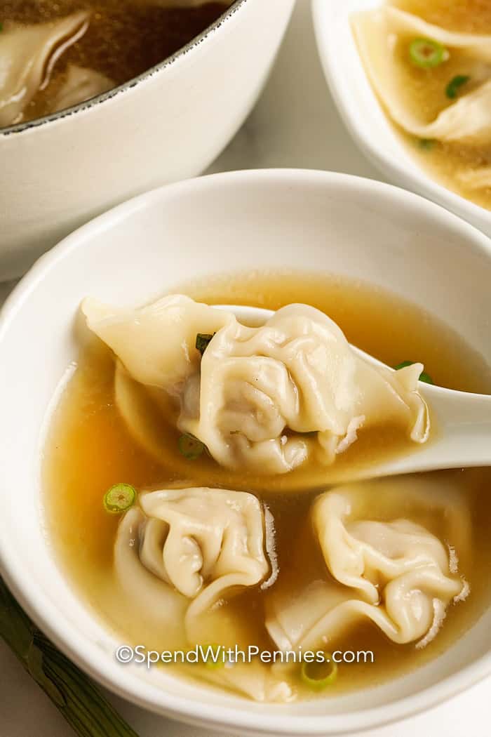 Homemade Wonton Soup in a bowl with a spoon