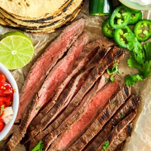 carne asade cooked and sliced with tortillas and jalapenos