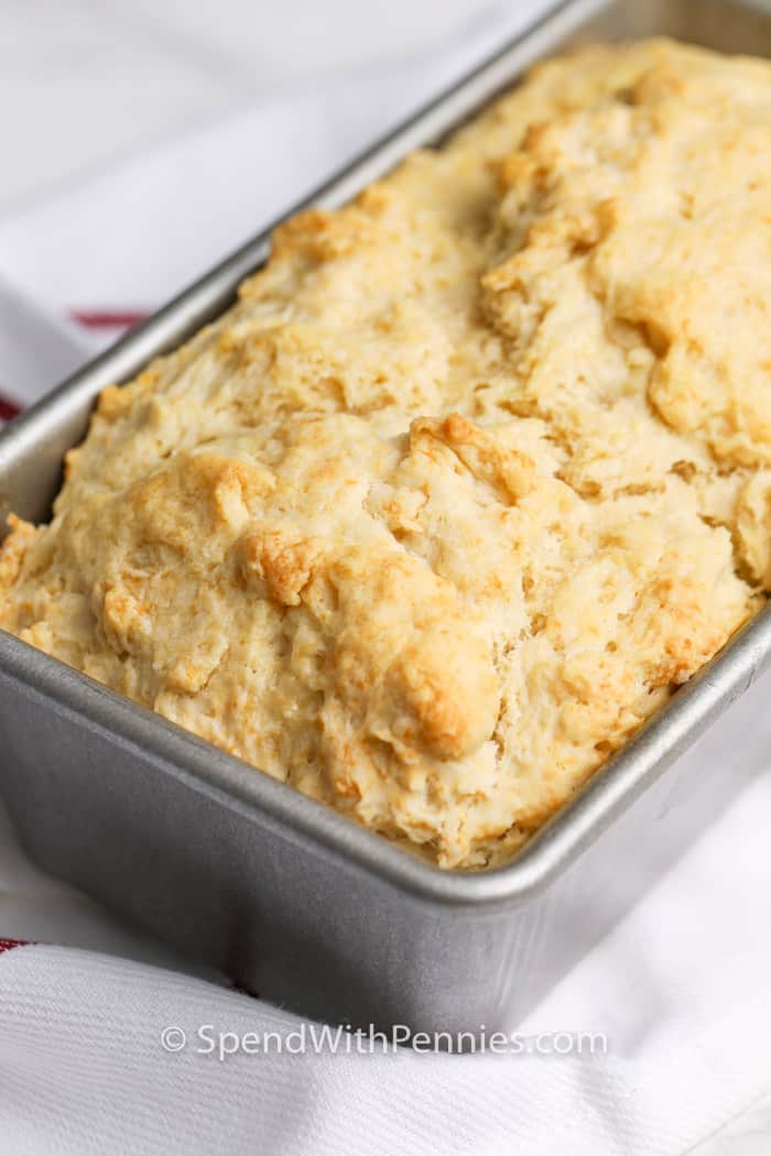 Beer bread is an easy, almost fool-proof recipe! Made with a handful of simple ingredients with no yeast, and no rise time, this is the best baked bread recipe. It’s Great War, from the oven with a slab of butter or peanut butter! #beerbread #easybreadrecipe #homemadebeerbread #spendwithpennies Beer bread in a loaf pan