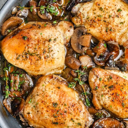 Braised Mushroom Chicken Thighs over the top view in a frying pan