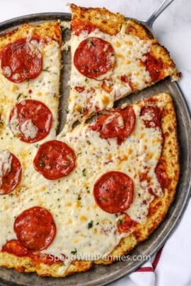 Cauliflower pizza crust pizza being served