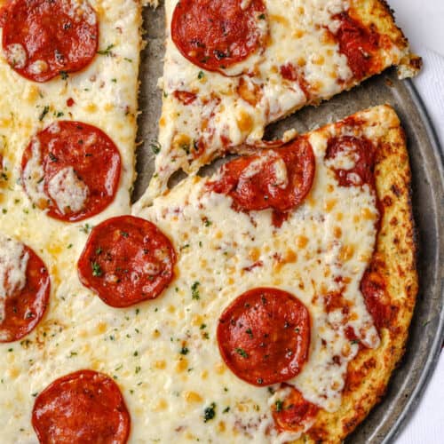 Cauliflower pizza crust pizza being served