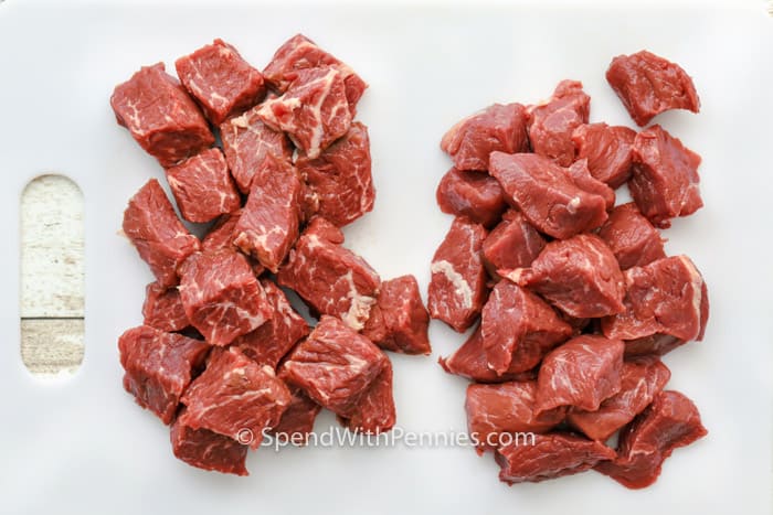 Stew meat cubed on a cutting board