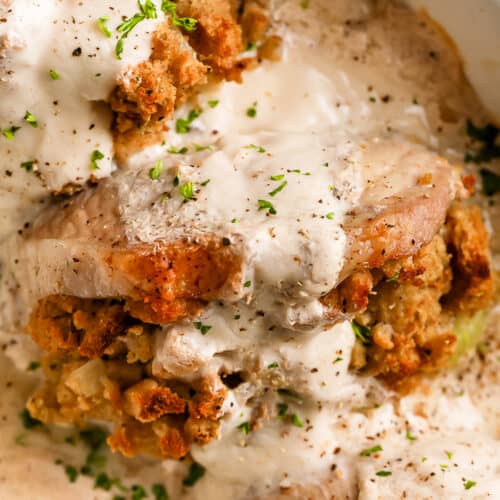 Stuffed pork chops baked in a casserole dish