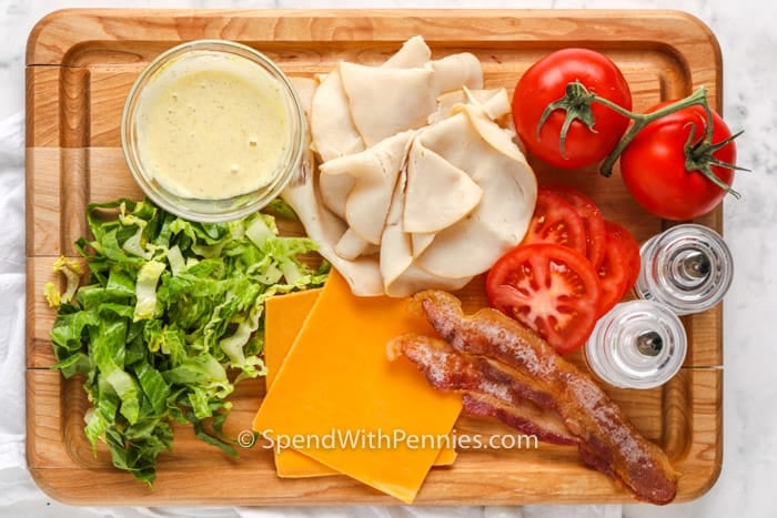 ingredients to make Turkey Wrap on a cutting board