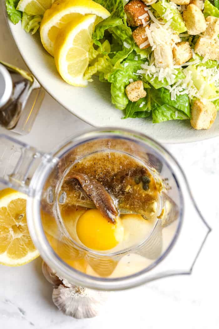 caesar salad dressing ingredients in a blender