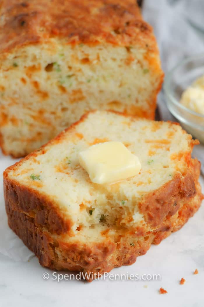 Cheese Bread with a bite taken out and butter melting