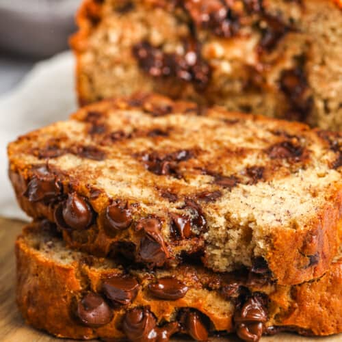 slices of chocolate chip banana bread on a wood board
