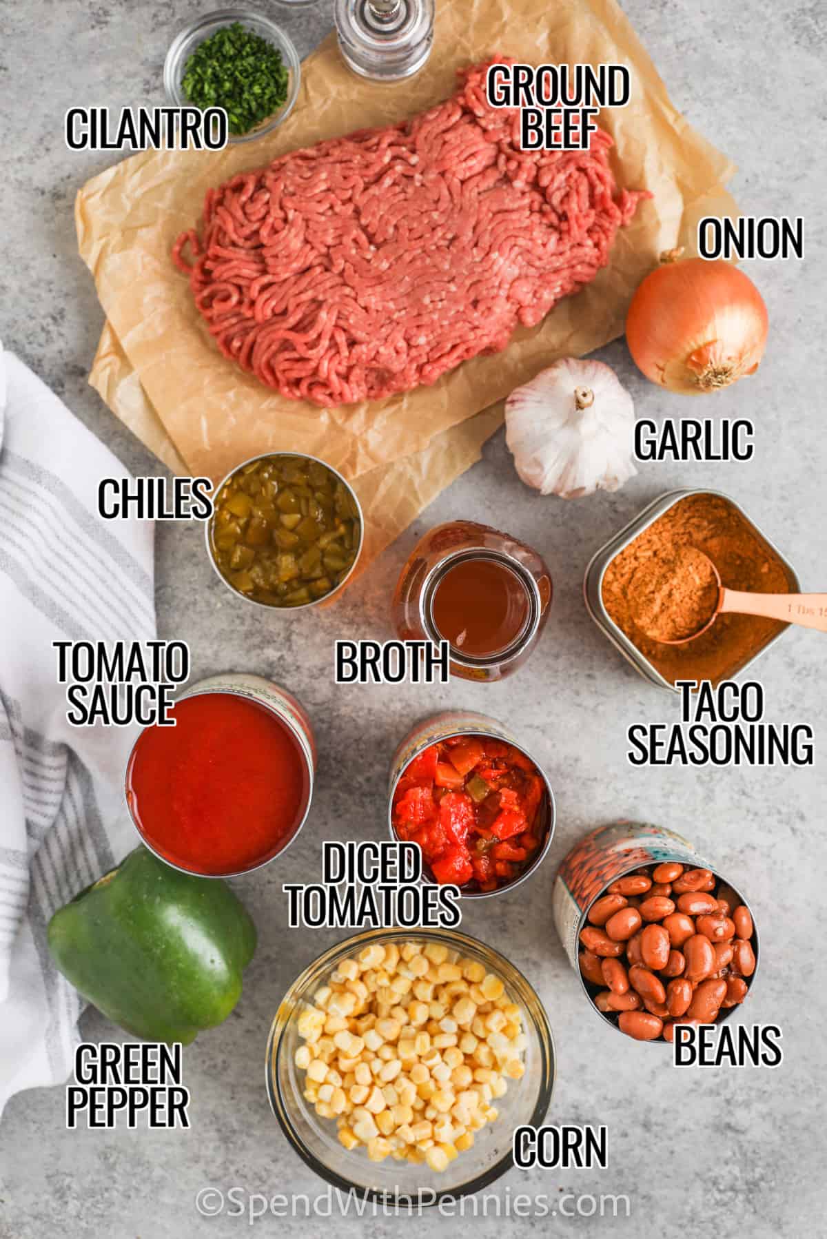 Taco soup ingredients like ground beef, beans, corn, tomatoes, peppers and taco seasoning meld together in a rich tomato-beef broth to create a thick and chunky soup that has just the right amount of kick! #spendwithpennies #soup #tacosoup #easyrecipe taco soup ingredients