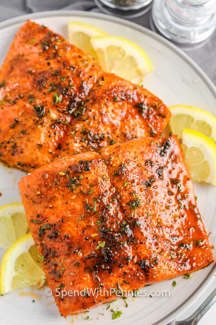 Air Fryer Salmon on a plate with lemon slices