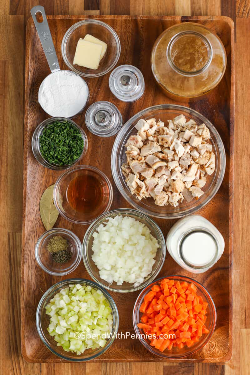 ingredients for cream of chicken soup on a wood board