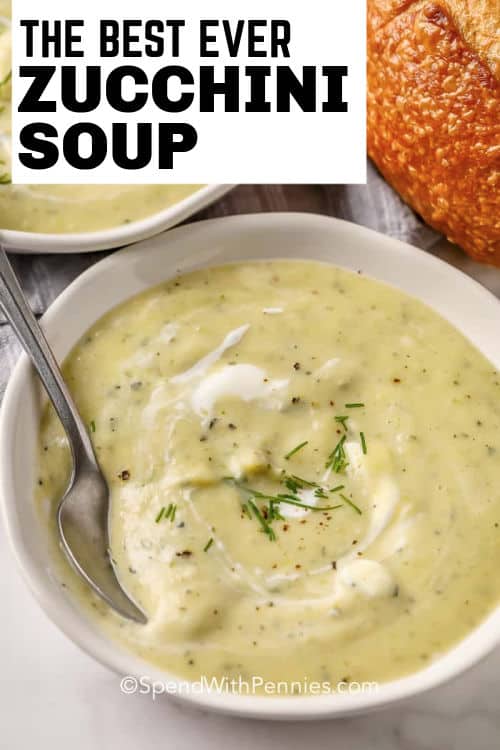 Zucchini Soup in a white bowl with a spoon and writing